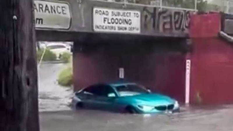 Family trapped in floodwater under bridge as record rainfall hits Melbourne