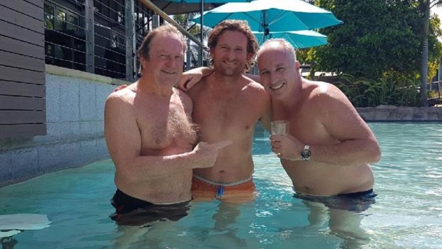 Paul Finn (on right), pictured with Kevin Sheedy and James Hird, was banned for life by the AFL from Marvel Stadium.