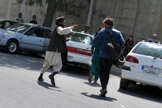 A young Talib belts Quilty with a piece of hose as the Taliban poured into Kabul last August.