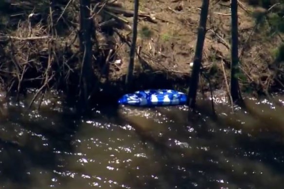 An overturned kayak was located on the river before the man’s body was found.
