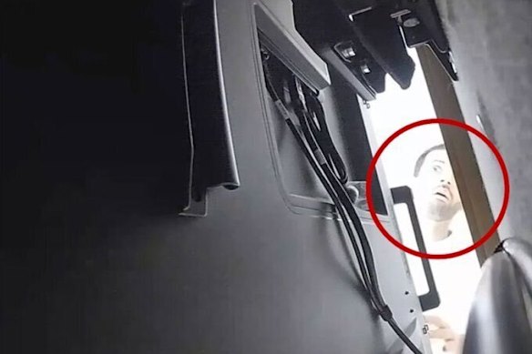 An image released by the US Department of Justice appears to show Abdulrahman Alfozan behind the TV where a bug was hidden. 