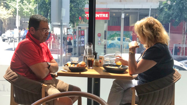 Surveillance photo of councillor Sam Aziz meeting ex-MP Lorraine Wreford in a city cafe so she could give him cash. 