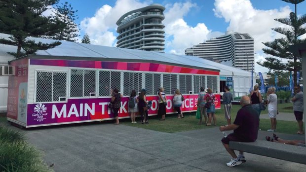 People buying Commonwealth Games tickets at Broadbeach on the Gold Coast on Tuesday.