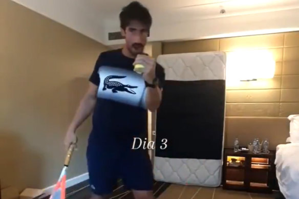 Pablo Cuevas practises his backhand against a mattress in hotel quarantine ahead of the Australian Open.