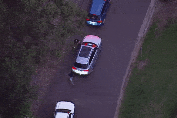 Correctives Services officers try to stop this masthead from photographing Roberts-Smith.