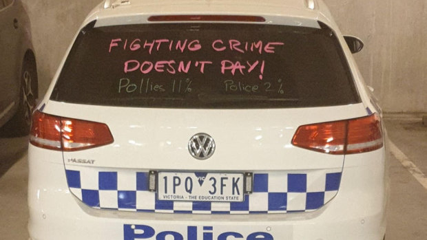 Police painted slogans on their cars as part of the industrial action.