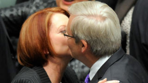 Then Prime Minister Julia Gillard hugs and kisses foreign minister Kevin Rudd after the carbon tax legislation was passed in the House of Representatives.
