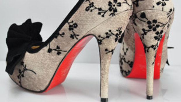 Christian Louboutin shoes with their trademark red soles.