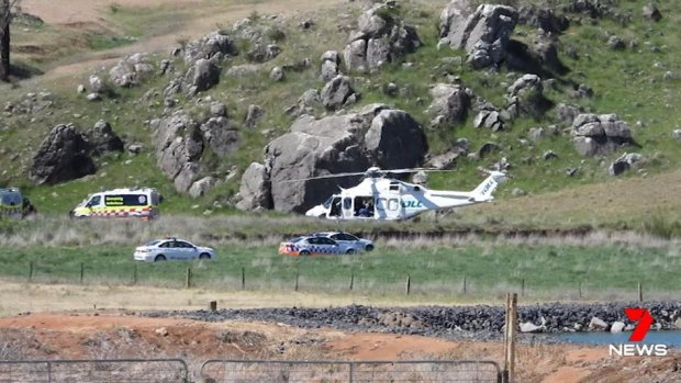 Emergency services attend a property after a young boy was injured when a creek bed collapsed in Molong, NSW. 
