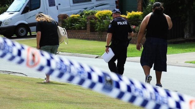  The family of Sandra Peniamina speak with police after she was stabbed to death by her husband, Arona.