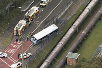 A man has died after a bus and car crashed near Smithfield. 