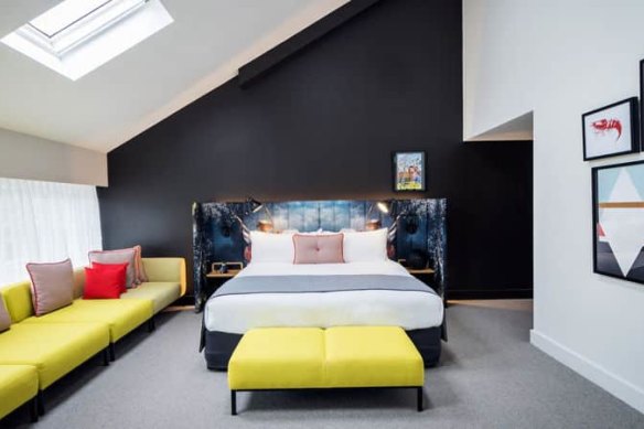 Ovolo Woolloomooloo rooms pop with bright colours and stunning harbour and city views.