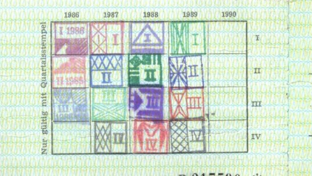 On the reverse side, stamps show the card remained in use to the final quarter of 1989, when protests precipitated East Germany's collapse.