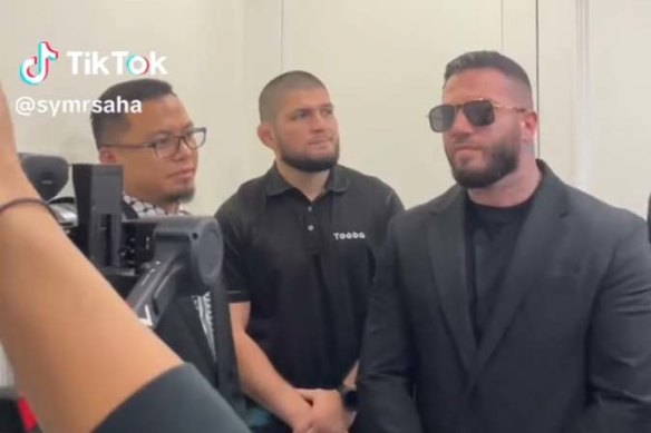 Suleiman “Sam” Abdulrahim (right) working as a bodyguard for MMA legend Khabib Nurmagomedov (centre).