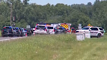 Emergency services at the scene of a plane crash in Missouri which killed 12 people.