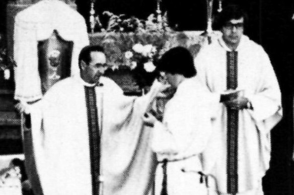 Bishop Ronald Mulkearns officiates at a mass in 1980. 