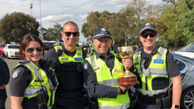 A special moment for Acting Sergeant Trevor Bergman and colleagues at Flemington this afternoon.