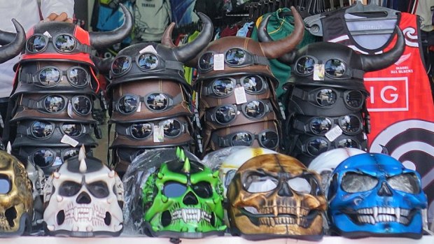 A selection of motorcycle helmets for sale in Kuta.