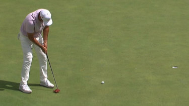 Jason Day birdies the 16th hole to move into a share of the lead during the second round of the Masters.