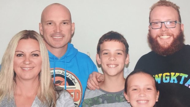 Scott Blanchard in the blue top with his three kids and wife Justine.