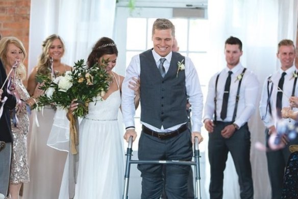 Sam Willoughby walking down aisle for his wedding to Alise, in 2018.