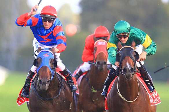 Golden moment: Nash Rawiller gives a flourish of the whip as Pierro beats Snitzerland in the 2012 Golden Slipper Stakes at Rosehill.