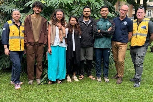 Missing Australian hiker Cara Severino with DFAT officials after her rescue in Nepal