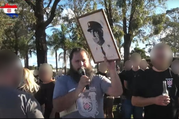 Celebration of the creation of the Nazi-backed state of Croatia in western Sydney at the Croatian Club Bosna this year. Club president Adam Glavas is holding a portrait of World War II dictator Ante Pavelic.