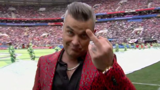 A bit rude: Robbie Williams gives the camera the finger at the end of his performance. 