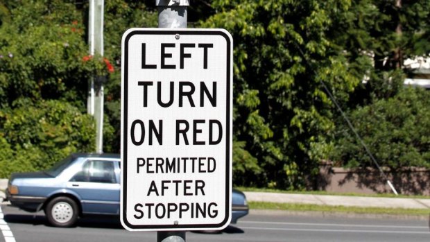 Several left-turn-on-red signs will be removed in Brisbane for not complying with newly enforced road rules.