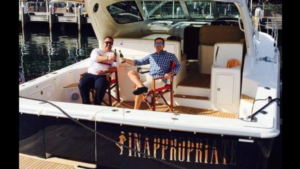 Former McGrath Real Estate agent Adrian Bo, right, on his boat, "Inappropriate" with his brother Marcello.