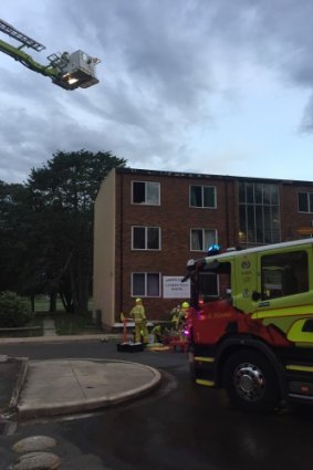 Firefighters attend a fire at a third-floor apartment at Gowrie Court in Narrabundah.