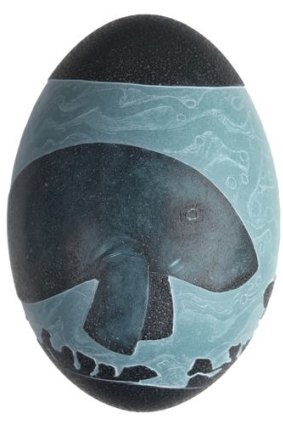 Carved emu egg by Esther Kirby, featuring a dugong.