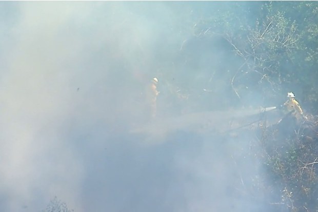 In the afternoon, a wind change brought fresh challenges as billows of smoke blanketed the mountain.