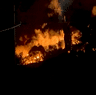 An oil drum storage facility in Brisbane’s east burst into flames overnight, throwing fireballs and billows of smoke into the air.