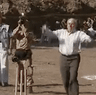 Former prime minister John Howard bowls a ball during a cricket game in Pakistan in 2005.