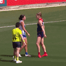 Melbourne’s Eden Zanker taunts former Demons teammate Libby Birch, now at North Melbourne, in the 2025 AFLW preliminary final.