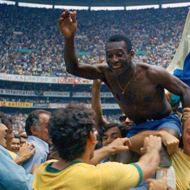 Pele is hoisted on the shoulders of his teammates after Brazil won the 1970 World Cup.