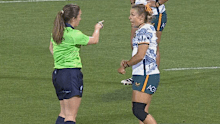 Georgina Friedrichs shows her wrist to the referee.