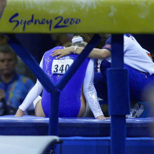 Great Britain's Annika Reeder injures her ankle after falling on the incorrectly set vault.