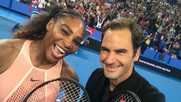 Picture perfect: Roger Federer snaps a selfie with Serena Williams at the Hopman Cup in Perth.