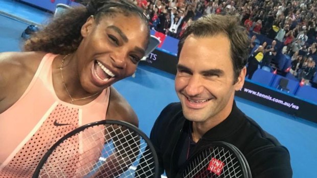 Great shot: Roger Federer snaps a selfie with Serena Williams at the Hopman Cup in Perth.