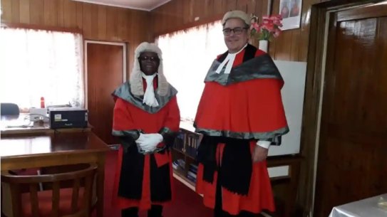 Kiribati High Court Justice David Lambourne, right, pictured in 2019 with Sir John Baptist Muri, a former chief justice of the High Court of Kiribati. The Kiribati government has been seeking to deport Lambourne.