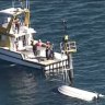 Cruiser barely afloat after high-speed crash into Moreton Bay beacon
