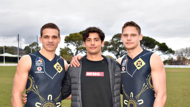 Ash Johnson, his brother Crows footballer Shane McAdam and their cousin Jy Farrar, now with Gold Coast, at Scotch Old Collegians.