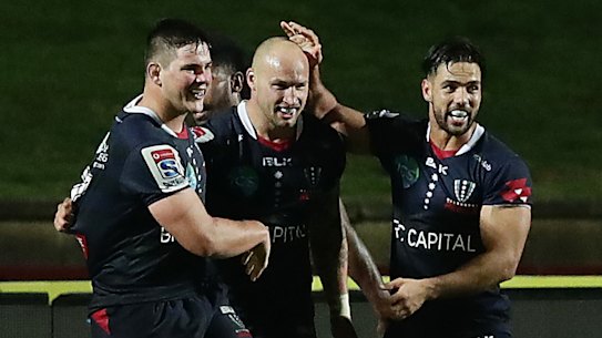 Rebels centre Billy Meakes scores a try against the Reds in Super Rugby AU. 
