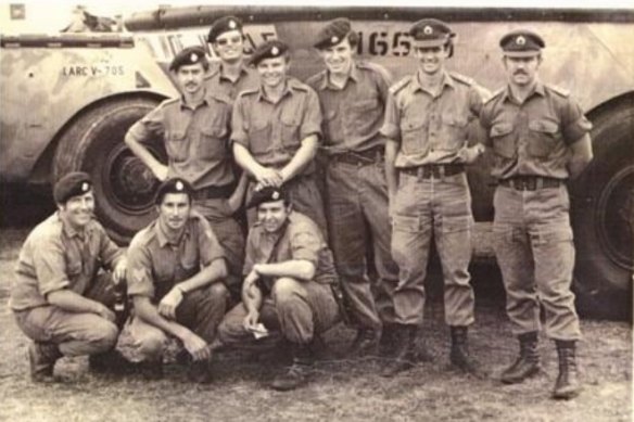 Corporal Neville Hourigan kneels (far left) beside his crewmates of the 40 Transport Amphibious Vehicles Platoon in late 1973.