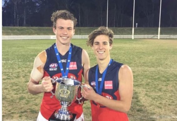Giants pair Kieren Briggs and James Peatling celebrating a 2017 premiership with the Pennant Hills Football Club.