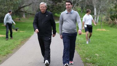 Prime Minister Kevin Rudd walks with adviser Patrick Gorman in 2013.
