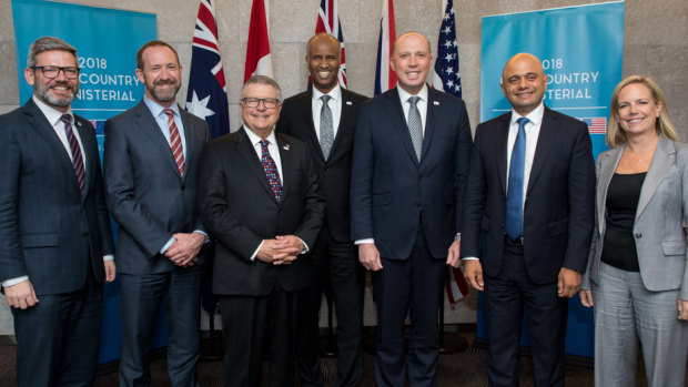 Out and proud ... Peter Dutton, third from right, with fellow ministers representing the Five Eyes intelligence allies at a meeting on the Gold Coast.